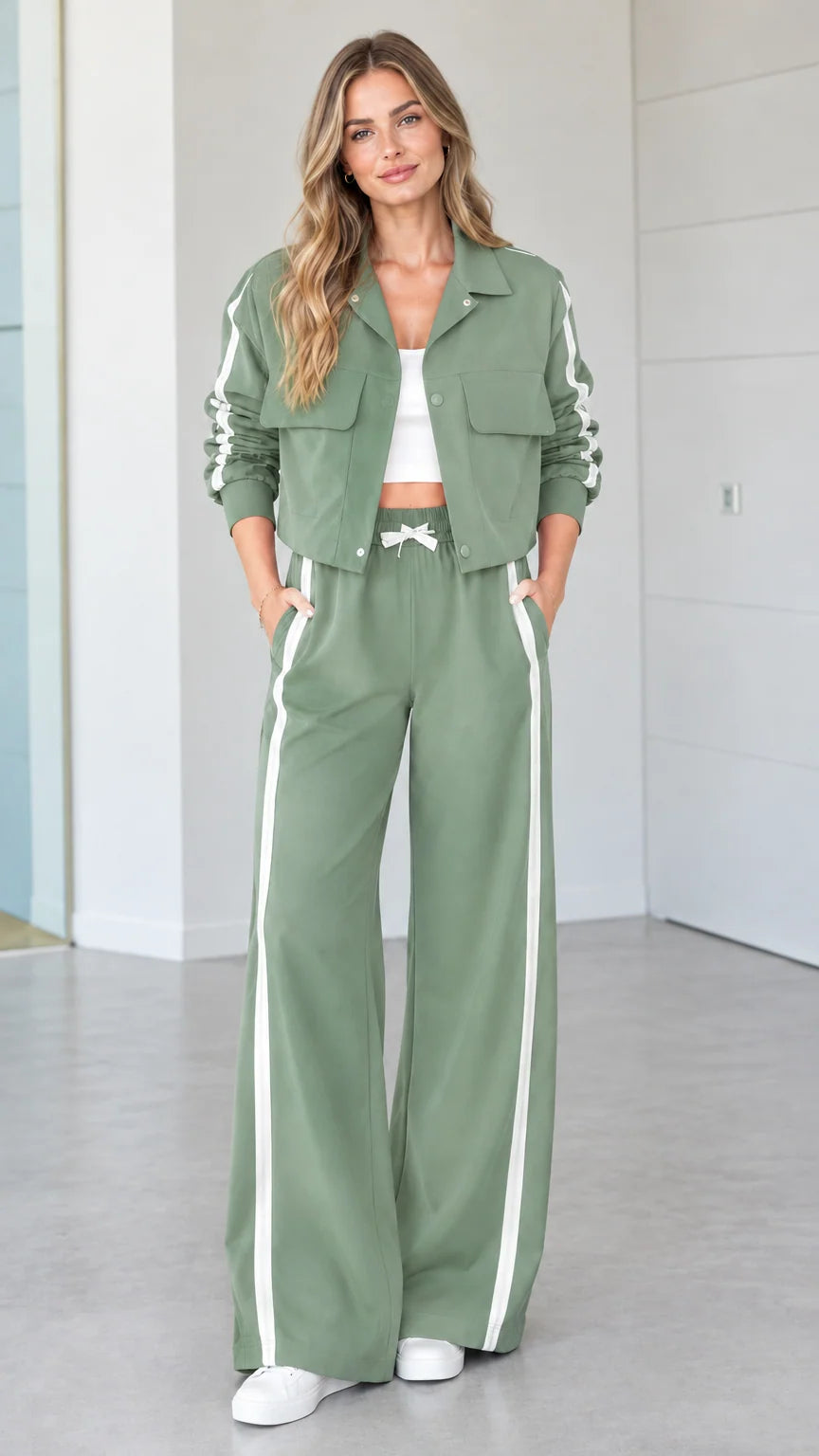 Woman wearing sage green 2-piece side stripe cropped jacket and wide-leg pants set