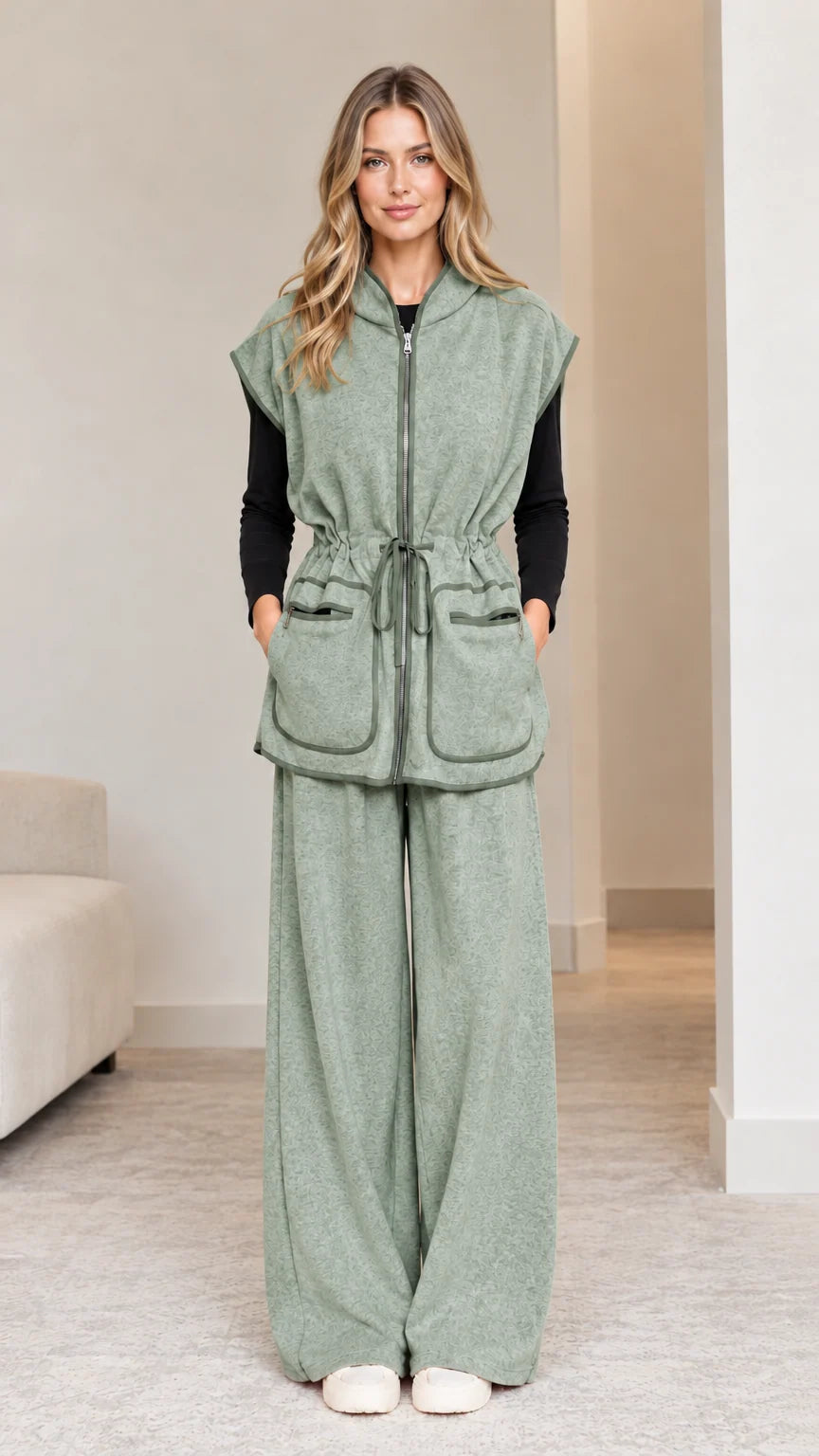 Model wearing sage green 2-piece hooded vest and wide-leg pants set