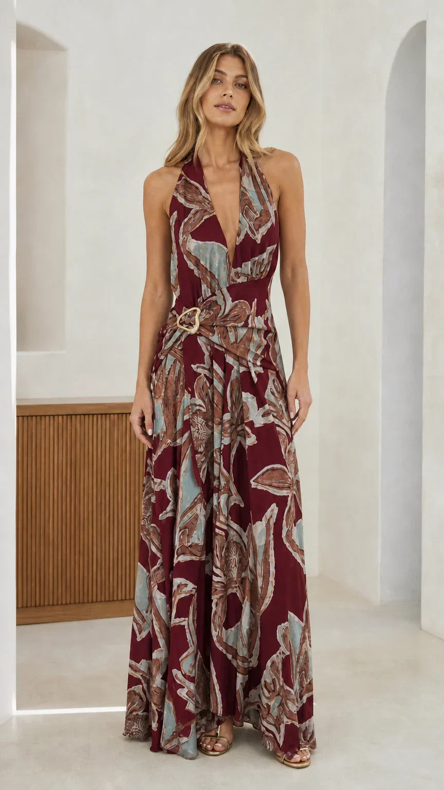 Front view of burgundy abstract print halter maxi dress