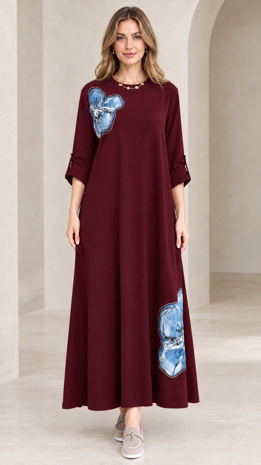 Model wearing deep burgundy wine floral appliqué maxi dress