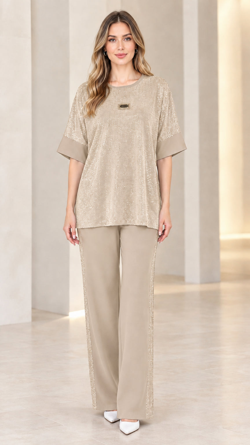 Full-length view of model wearing champagne gold shimmer knit matching two-piece set