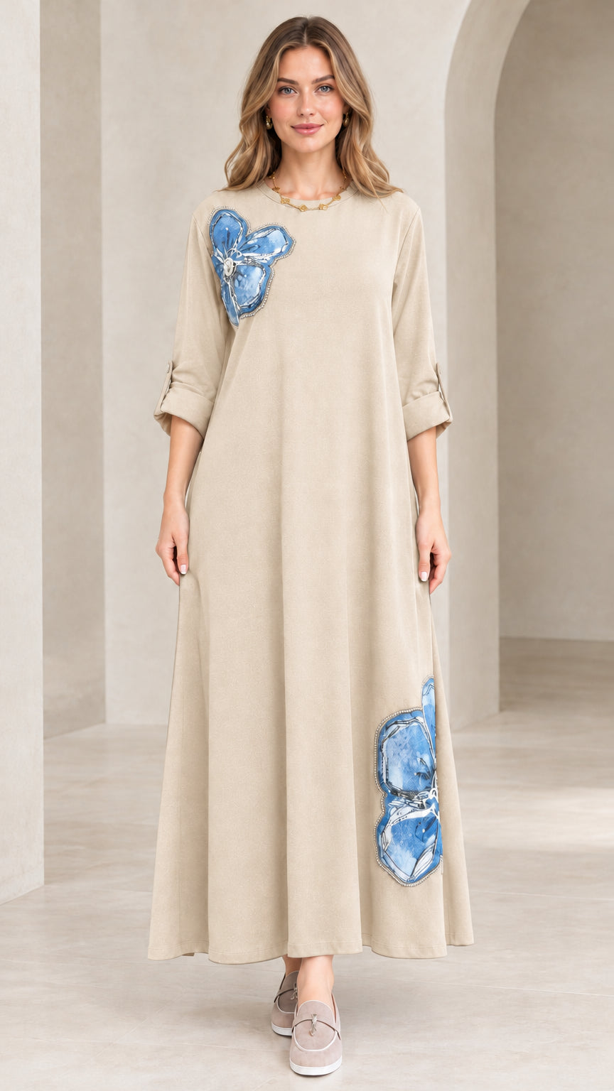 Model wearing light beige neutral floral appliqué maxi dress